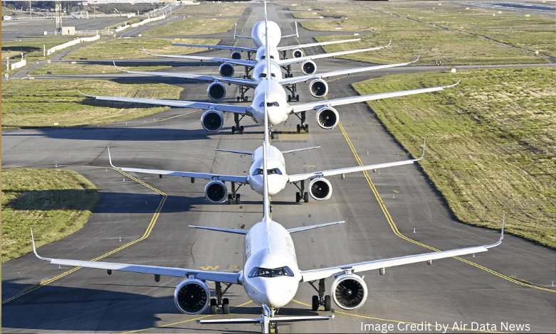 Airbus and Boeing commercial aircraft parked at airport gates in 2025