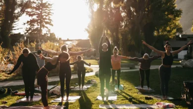 People practicing yoga outdoors as part of simple daily habits for fitness and wellness