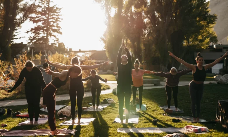 People practicing yoga outdoors as part of simple daily habits for fitness and wellness