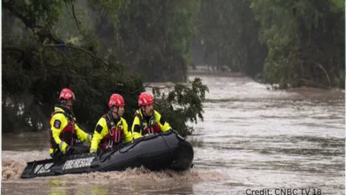 Emergency responders evacuating residents during New York flooding 2025