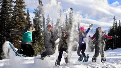 "Group of Canadians participating in cold-weather workouts like ice yoga and snowshoeing in a snowy outdoor setting"