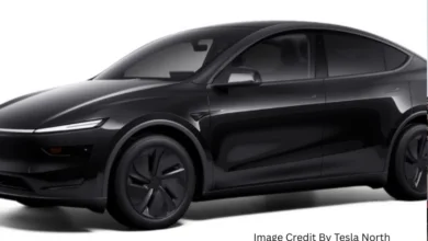 Tesla Model Y in Diamond Black color parked in an urban Canadian setting, showcasing the latest design