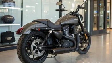 2026 Harley-Davidson Sprint parked on a city street, showcasing vintage styling, compact frame, and matte finish
