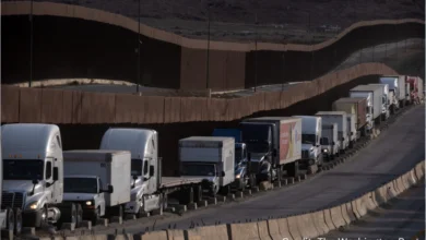 Freight trucks lined up at the U.S.-Canada border amid rising tariffs on Canadian goods