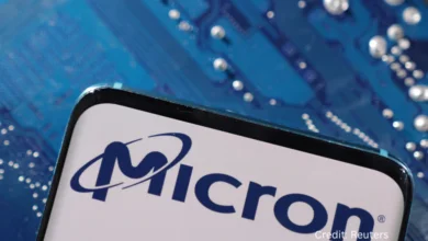Technician inspecting a Micron memory chip wafer highlighting AI-driven growth and Q4 2025 earnings momentum