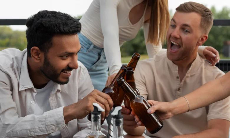Vancouver’s North Shore Craft Beer Festival group of friends raising beer bottles in an outdoor celebration