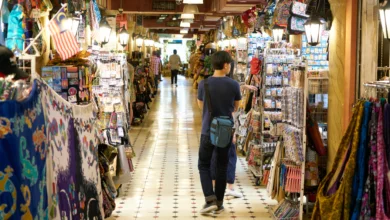 Surrey maker markets featuring shoppers browsing handmade crafts, local art, and colorful stalls inside a community market space.