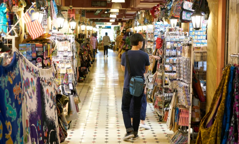 Surrey maker markets featuring shoppers browsing handmade crafts, local art, and colorful stalls inside a community market space.