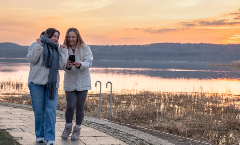 Two women enjoying a sunset waterfront walk during Vancouver’s Sunset Walk & Chill Events