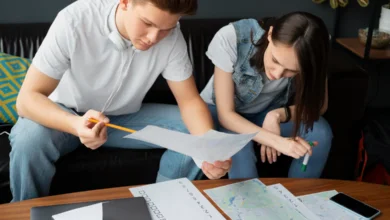 Young couple reviewing bills and budget plans as part of How Vancouver Families Are Cutting Monthly Expenses at home
