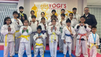 Yogi’s Karate Dojo Abbotsford students displaying medals after karate championship victory