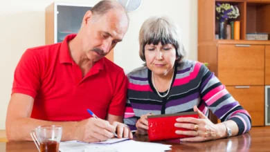 Senior couple reviewing finances and planning CPP & retirement income in Canada for a secure future