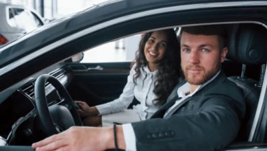 Couple sitting inside a new car representing car ownership in Canada and modern lifestyle mobility choices