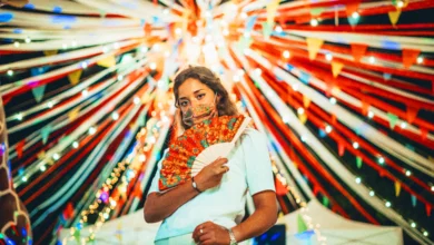 Woman enjoying cultural festivals in Canada 2026 with colorful lights and festive decorations