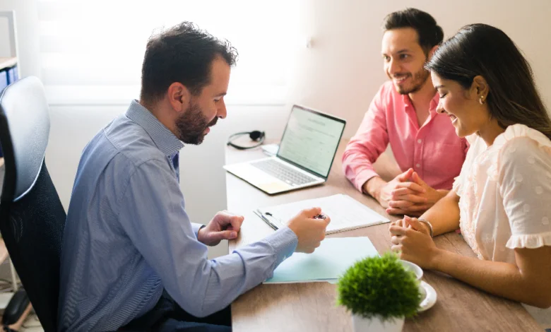 insurance near me consultation with broker helping couple choose best insurance plan