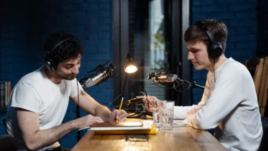 Hosts recording Front and Nationwide Podcast in a modern podcast studio
