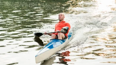 Man kayaking during Rolling Waters Adventures on a scenic river